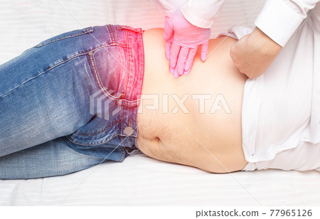 Doctor nephrologist probes a patient's diseased kidney. Kidney disease concept, kidney stones and kidney failure. Doctor nephrologist probes a patient's diseased kidney. Kidney disease concept, kidney stones and kidney failure. 77965126