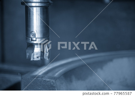 The CNC milling machine cutting the cast iron . The CNC milling machine cutting the cast iron . 77965587