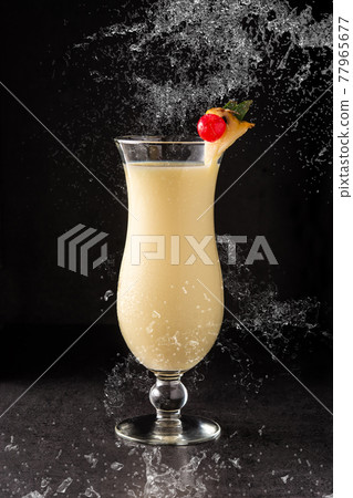 Splash of pina colada cocktail 77965677