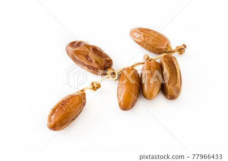 Dates isolated on white background Dates isolated on white background 77966433