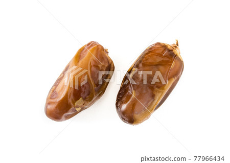 Dates isolated on white background Dates isolated on white background 77966434