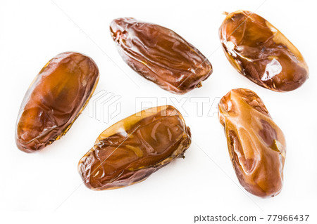 Dates isolated on white background Dates isolated on white background 77966437
