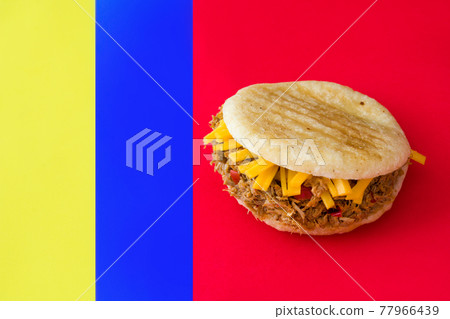 Arepa with shredded beef and cheese on 77966439