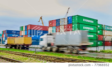 Odessa, Ukraine - May 19, 2021: Freight containers in the port terminal. Containers labeled Evergreen in the foreground. Odessa, Ukraine - May 19, 2021: Freight containers in the port terminal. Containers labeled Evergreen in the foreground. 77966932