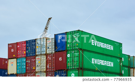 Odessa, Ukraine - May 19, 2021: Freight containers in the port terminal. Containers labeled Evergreen in the foreground. 77966935