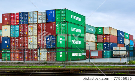 Odessa, Ukraine - May 19, 2021: Freight containers in the port terminal. Containers labeled Evergreen in the foreground. 77966936