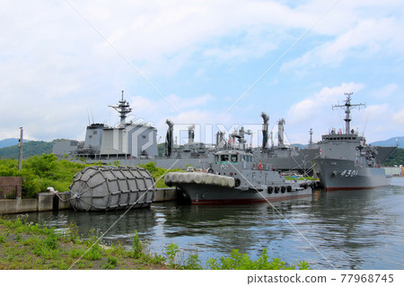 Multipurpose support ship Hiuchi, tugboat (towing ship), buffer buoy, and supply ship Masyu anchored at Maritime Self-Defense Force Maizuru Air Base Multipurpose support ship Hiuchi, tugboat (towing ship), buffer buoy, and supply ship Masyu anchored at Maritime Self-Defense Force Maizuru Air Base 77968745