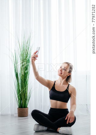 sportive life fitness woman home training lockdown 77971282