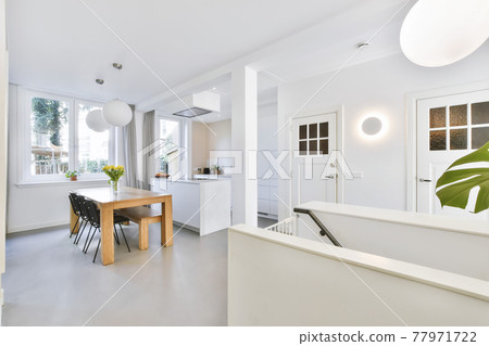 Open kitchen with dining table Open kitchen with dining table 77971722