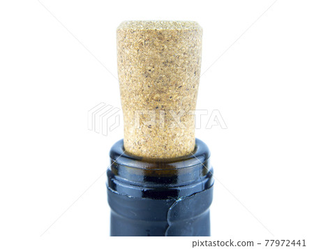 Cork from a wine bottle on a white background. 77972441