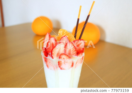 Panna cotta full of dessert strawberries Panna cotta full of dessert strawberries 77973159