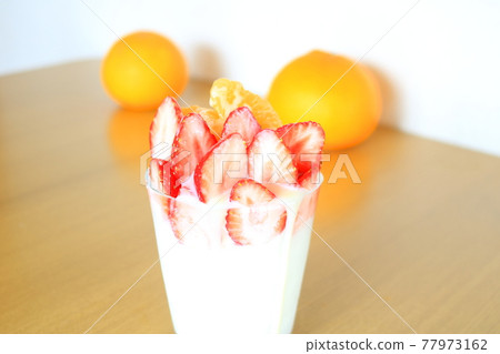 Panna cotta full of dessert strawberries Panna cotta full of dessert strawberries 77973162