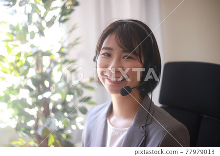 Female employee making a video call 77979013