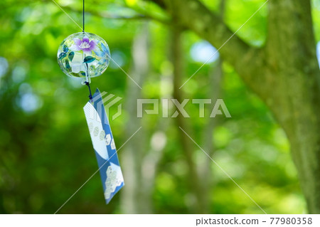 Wind chimes in the forest of sunlight through the trees 2 77980358