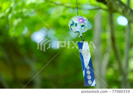 Wind chimes in the forest of sunlight through the trees 4 77980359
