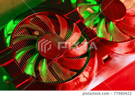 Coolers of the Gaming Video Card in red and green neon light. 77980422