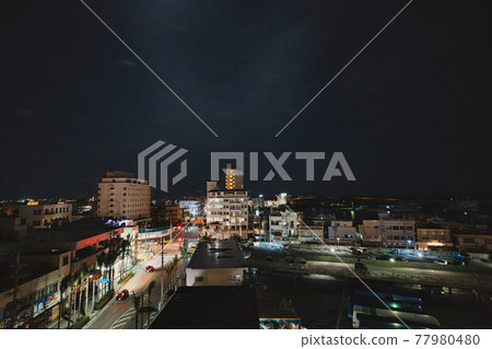 Night sky and cityscape Night sky and cityscape 77980480