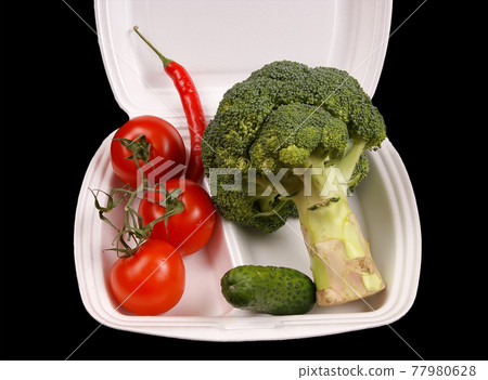 Closeup view of vegetables isolated on black and white background Closeup view of vegetables isolated on black and white background 77980628
