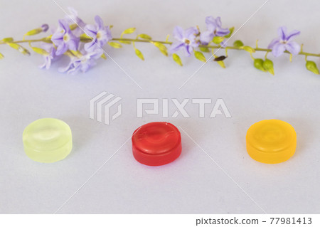 cough sore throat pastille colorful extract from herbal with purple flowers  77981413