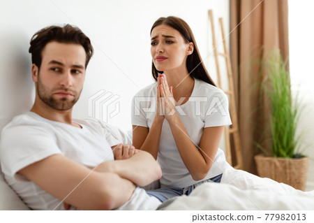 Unhappy Wife Pleading Offended Indifferent Husband For Forgiveness Indoor 77982013
