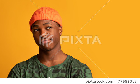 Doubtful Black Hipster Guy Looking Aside At Copy Space With Disbelief Doubtful Black Hipster Guy Looking Aside At Copy Space With Disbelief 77982015