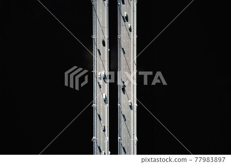 Aerial view of bridge over river with cars Aerial view of bridge over river with cars 77983897