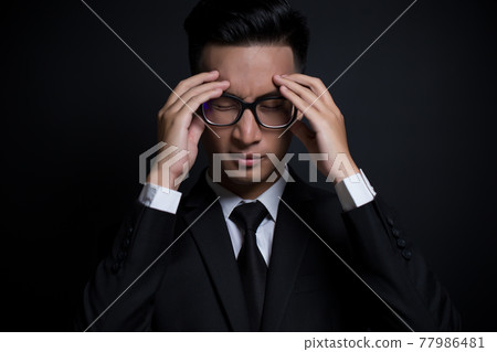 Businessman has head ache Businessman has head ache 77986481