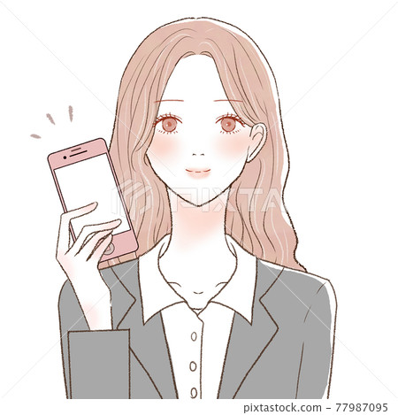 A woman in a suit holding a smartphone 77987095