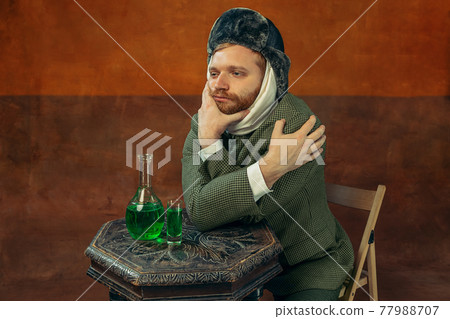 Portrait of red headed and bearded man playing famous artist isolated over dark bacground. Eras comparison Portrait of red headed and bearded man playing famous artist isolated over dark bacground. Eras comparison 77988707
