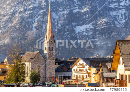 VIew of beautiful Hallstatt famous church during morning sunrise in early spring VIew of beautiful Hallstatt famous church during morning sunrise in early spring 77989213