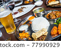 Traditional Nepali thali in restaurant 77990929