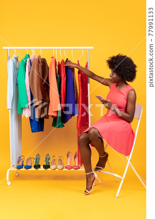 Happy Black Shopaholic Woman Using Smartphone For Online Shopping, Studio 77991133