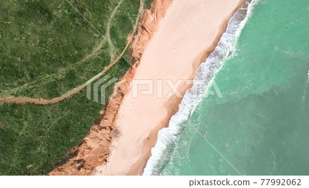 Top view aerial photo of an seascape with beach and sea with turquoise water in Sanzheyka, Odessa region, Ukraine Top view aerial photo of an seascape with beach and sea with turquoise water in Sanzheyka, Odessa region, Ukraine 77992062