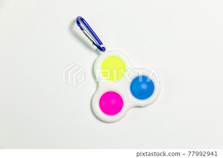 Simple Dimple Fidget toy, colorful anti-stress game isolated on white background 77992941