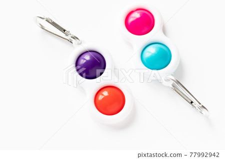 Simple Dimple Fidget toy, colorful anti-stress game isolated on white background 77992942