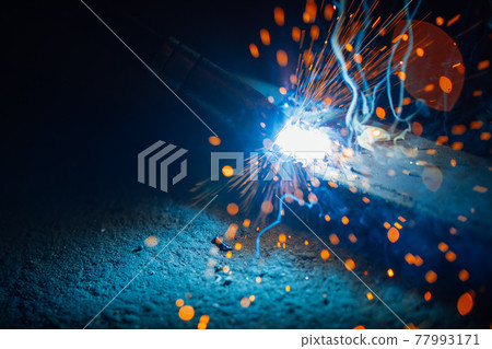 artistic welding sparks light, industrial background 77993171