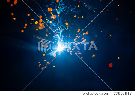 abstract welding sparks light, industrial background 77993918