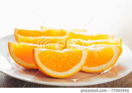 fresh orange slices on a plate fresh orange slices on a plate 77993948