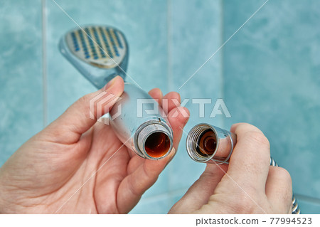 Detaching shower head from hose for cleaning or replacement. Detaching shower head from hose for cleaning or replacement. 77994523