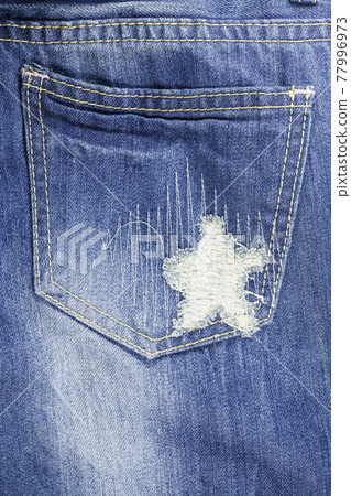 Blue torn denim jeans texture Blue torn denim jeans texture 77996973
