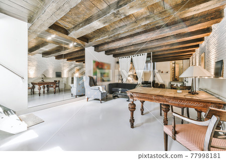 Spacious room with elegant furniture and wooden ceiling 77998181