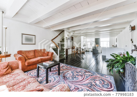 Spacious sitting room with sofas and carpet Spacious sitting room with sofas and carpet 77998183