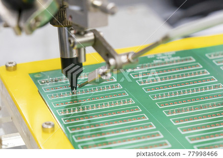 The soldering robot operation with PCB board.  77998466