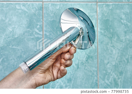 New flat shower head with flow control to replace old clogged one. New flat shower head with flow control to replace old clogged one. 77998735