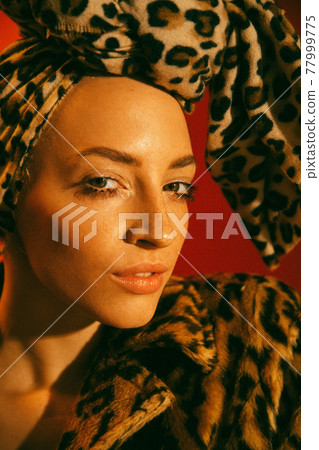 Woman with freckles skin standing in front of the camera with serious expression Woman with freckles skin standing in front of the camera with serious expression 77999775