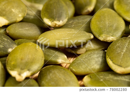 Portion of Pumpkin Seeds close-up shot selective focus Portion of Pumpkin Seeds close-up shot selective focus 78002280
