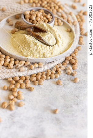 Plate of raw chickpea flour and beans Plate of raw chickpea flour and beans 78002522