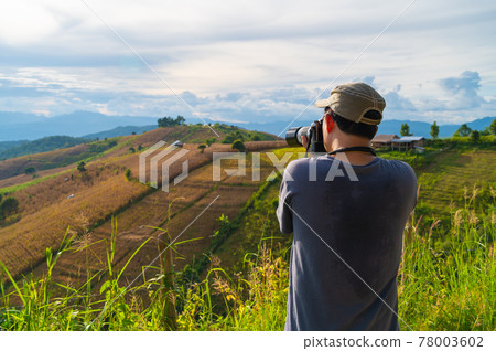 Portrait of senior man photographs rice field terrace in Ban Pa Bong Piang village Chiangmai Portrait of senior man photographs rice field terrace in Ban Pa Bong Piang village Chiangmai 78003602