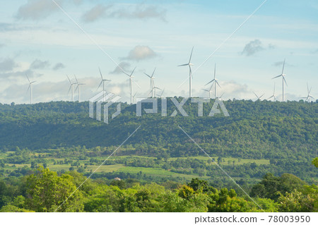Wind turbines or windmills farm field in industry factory. Power, sustainable green clean energy, and environment concept. Nature innovation. 78003950