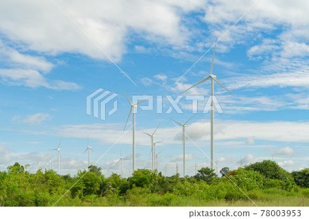 Wind turbines or windmills farm field in industry factory. Power, sustainable green clean energy, and environment concept. Nature innovation. 78003953